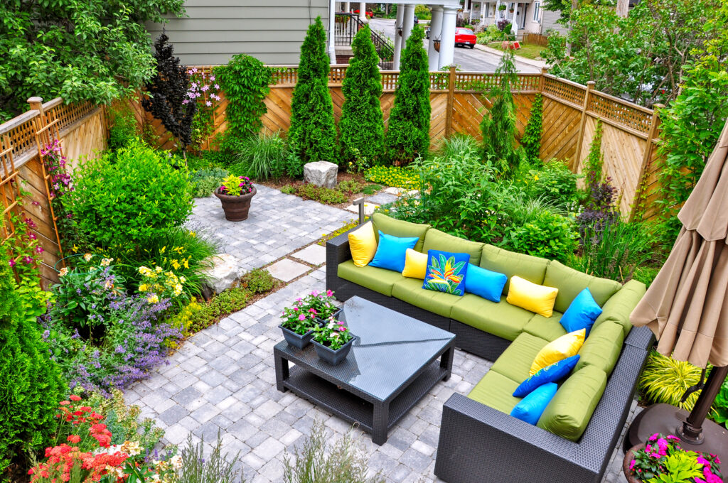 stone patio, colorful seating, backyard patio