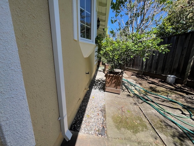 before narrow side-yard service path