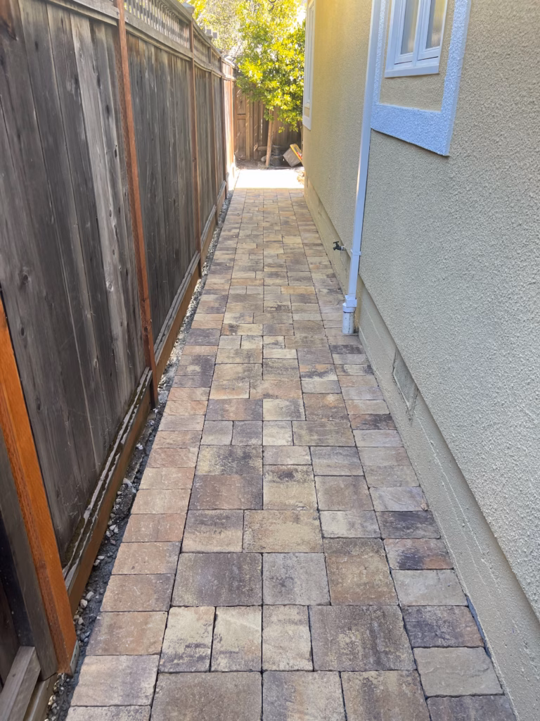 After — completed narrow side-yard paver walkway
