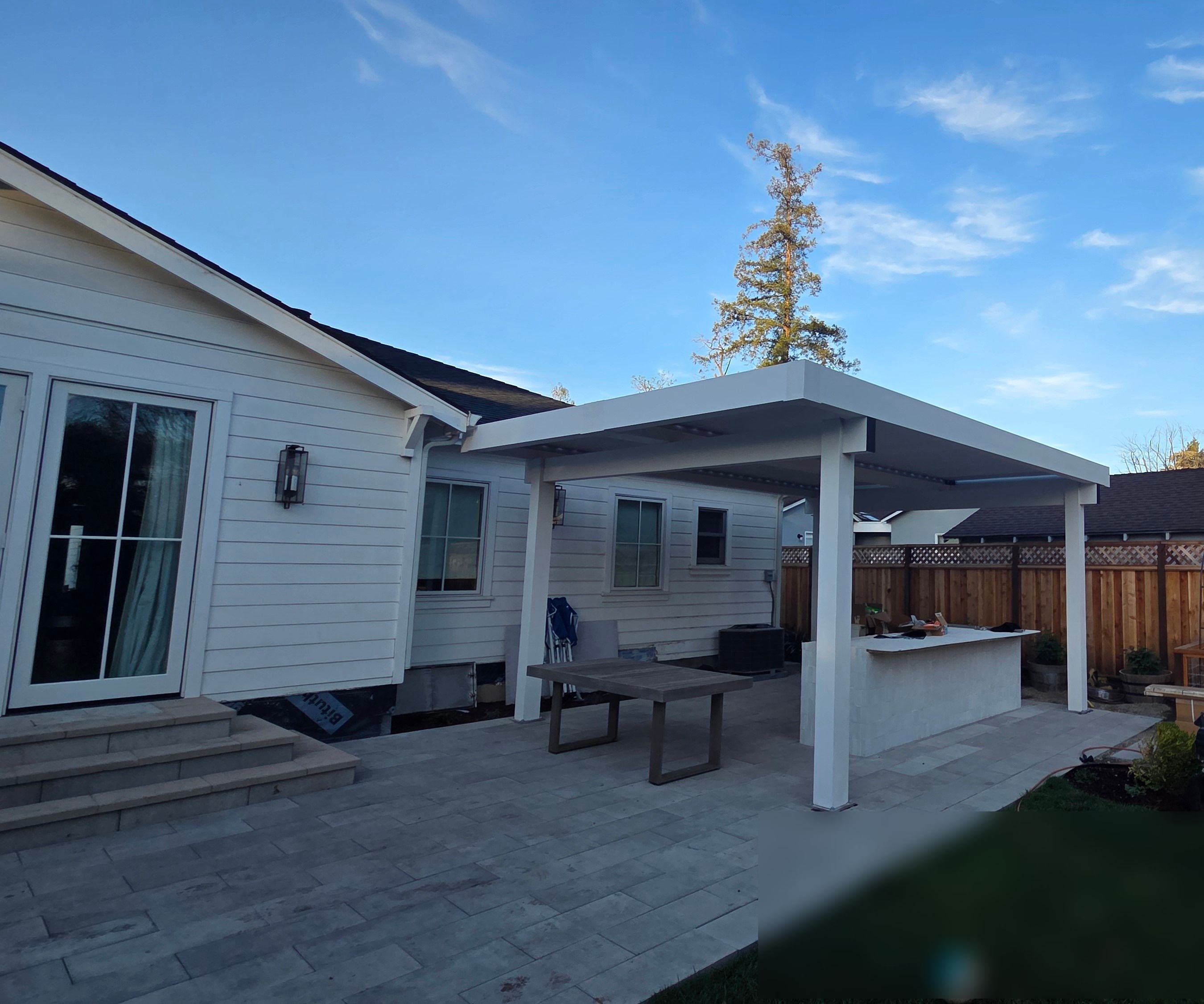 A Louvered Pergola, Paver Patio, and Outdoor Kitchen in Redwood Oaks