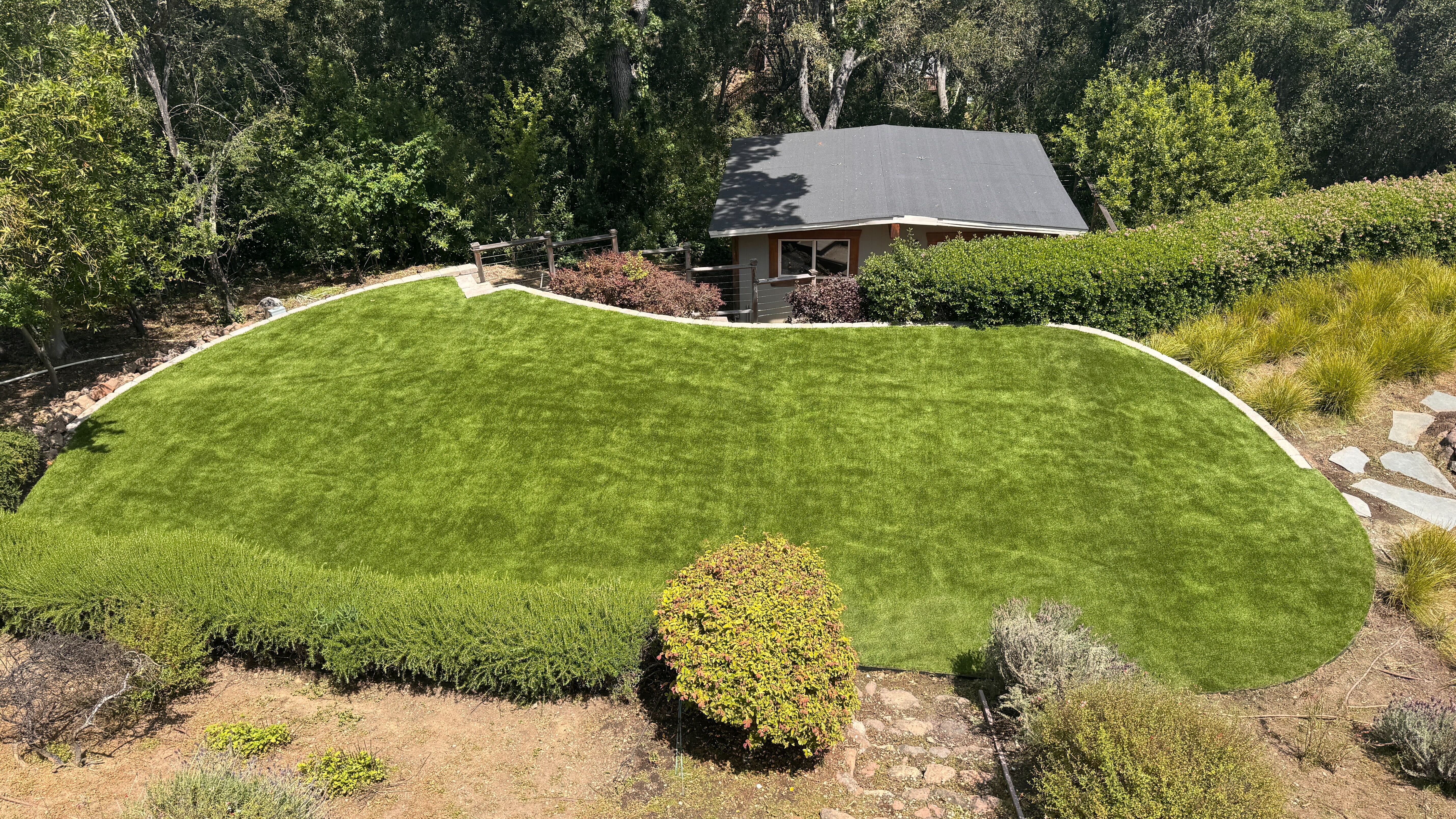 Curved Hillside Turf and Stone Walls in Woodside Glens