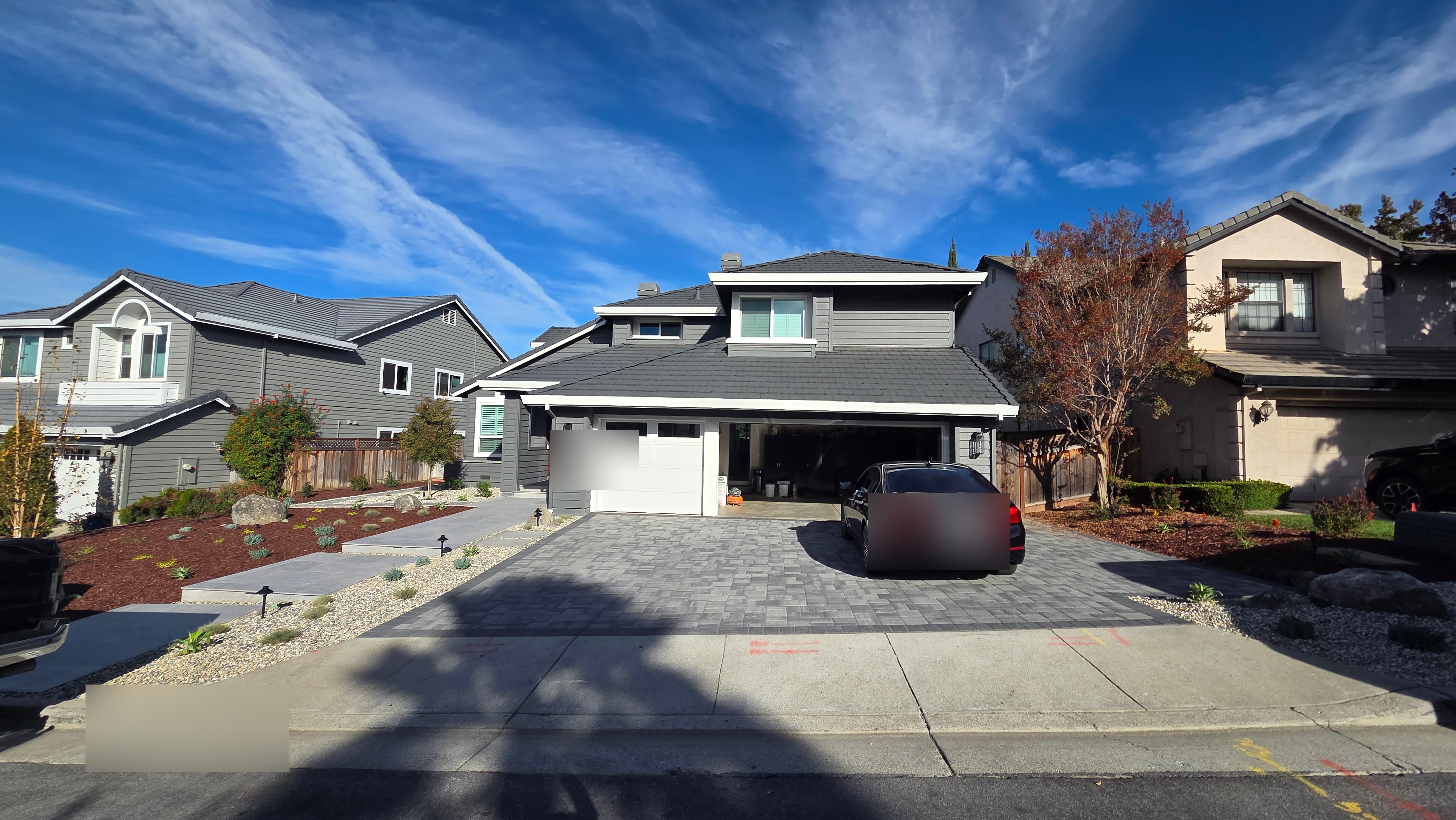 Finished Morgan Hill front yard from the street, with a new gray paver driveway and drought-tolerant planting beds.